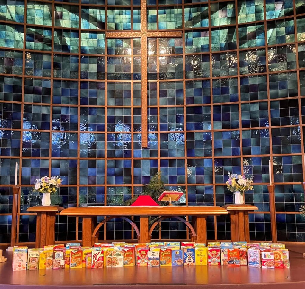 Photo of Bethany Church sanctuary with donated cereal boxes surrounding the altar.