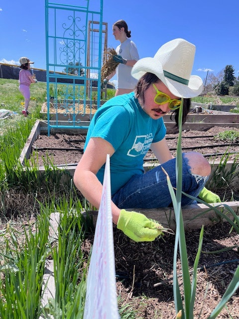 Nevan Mandel works in the HEA community garden.